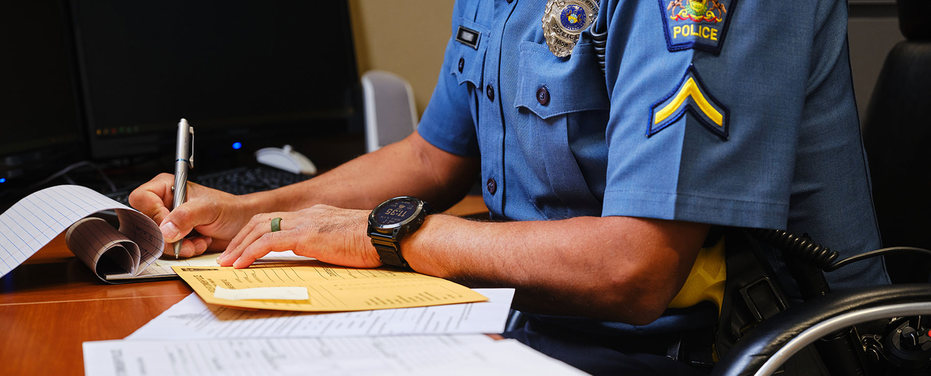 Police officer working at a desk