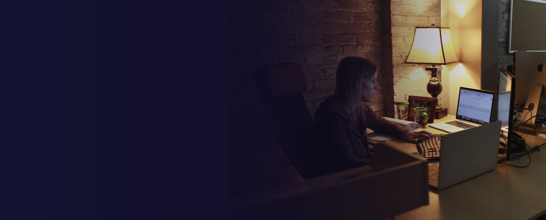 A developer focusing intently on her computer