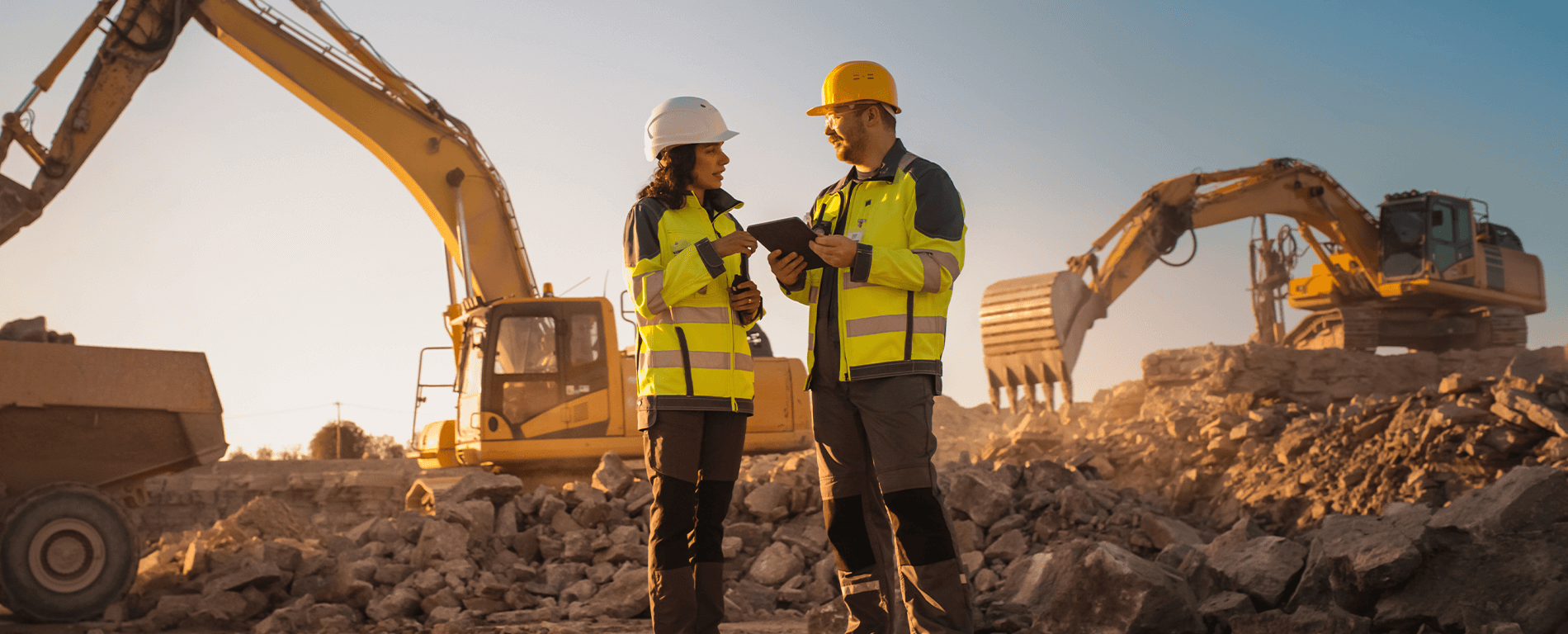Construction workers chatting with tablet in hand