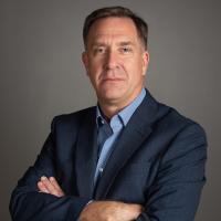 Author and researcher Donald Taylor posing with arms crossed