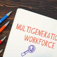 Pens on table with Multigenerational Workforce sign