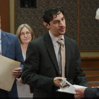 Three men in a courtroom