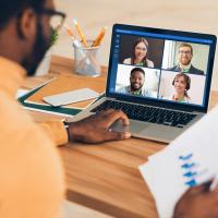 Man on virtual meeting taken place on a laptop