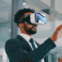 Man in suit with VR headset at work