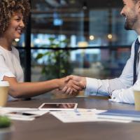 Employee shaking hands with another employee