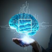 Hand holding blue brain image