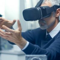 Photo of a man wearing a virtual reality headset