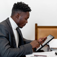 Man in office on tablet