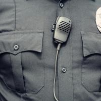 Close up of police uniform and badge