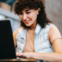 Woman sitting at laptop