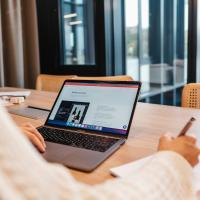 designer sitting at laptop