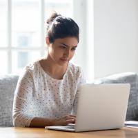Photo of a woman using a laptop