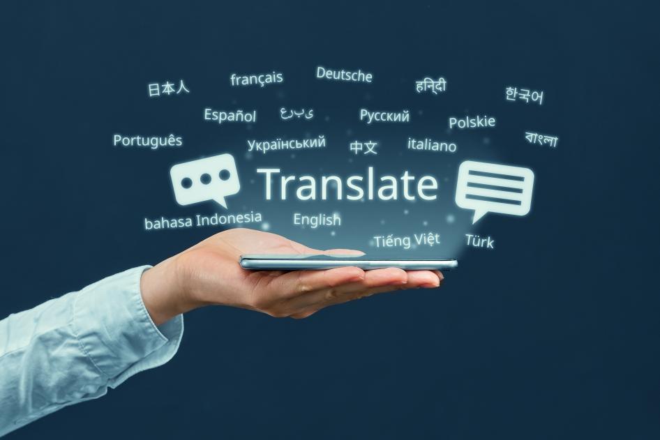 Hand holding graphic that says "translate" and various languages