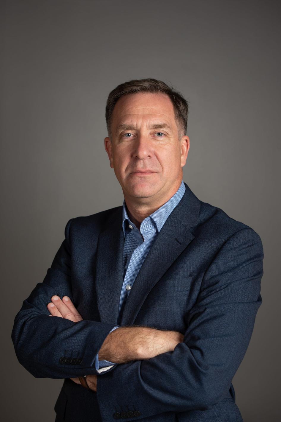 Author and researcher Donald Taylor posing with arms crossed