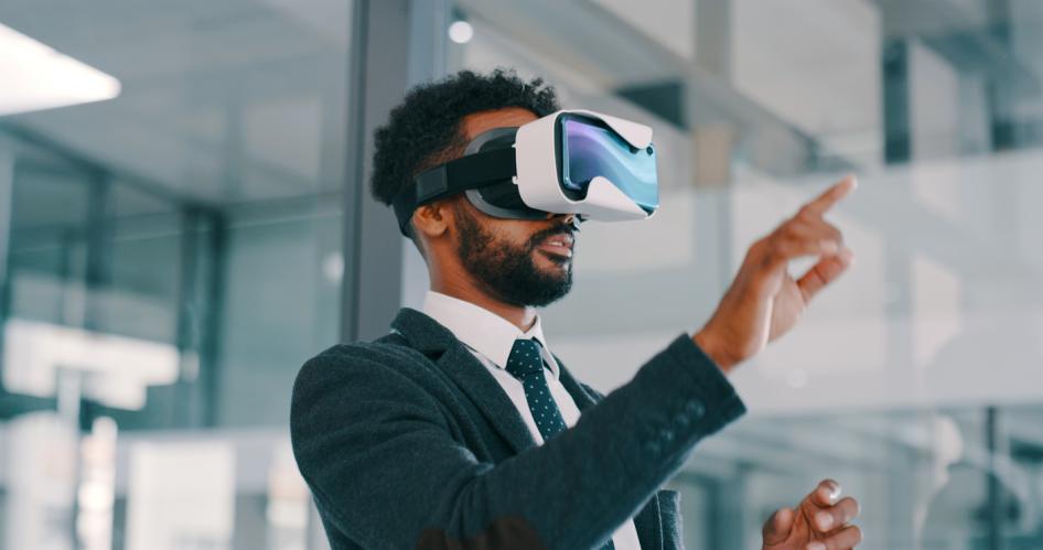 Man in suit with VR headset at work