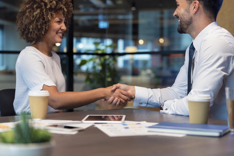 Employee shaking hands with another employee