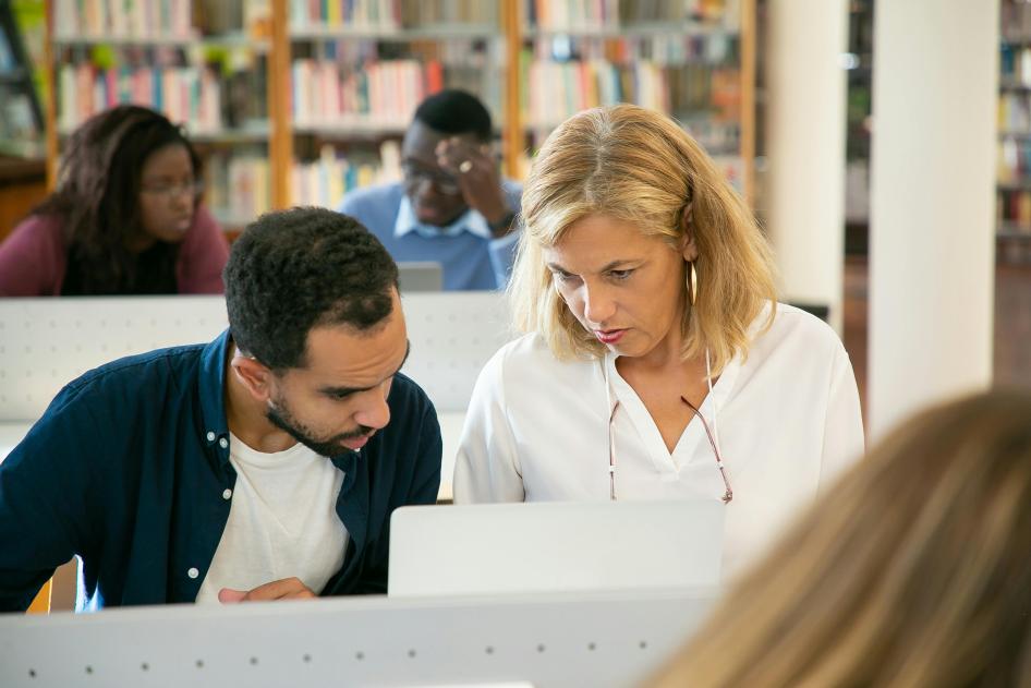 Man and woman looking at laptop