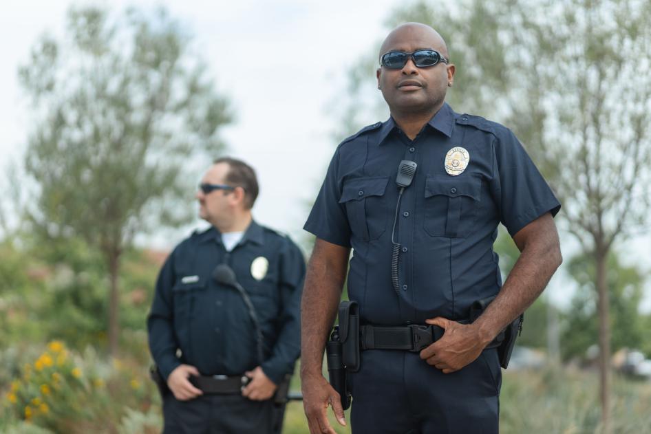 Two officers in uniform standing outside