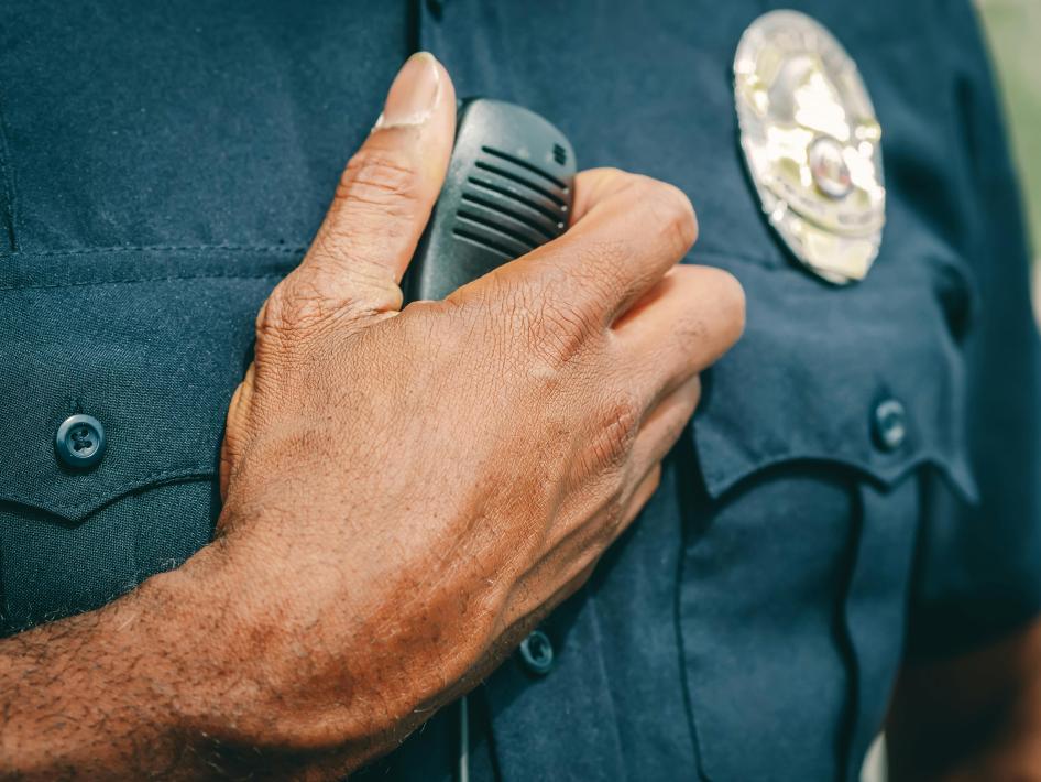 Close Up of Officer's Hand on Uniform