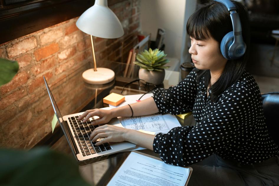 woman at computer with headset