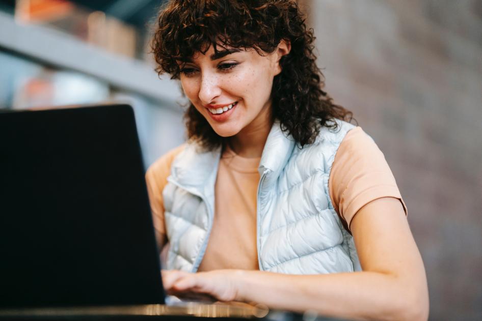 Woman sitting at laptop