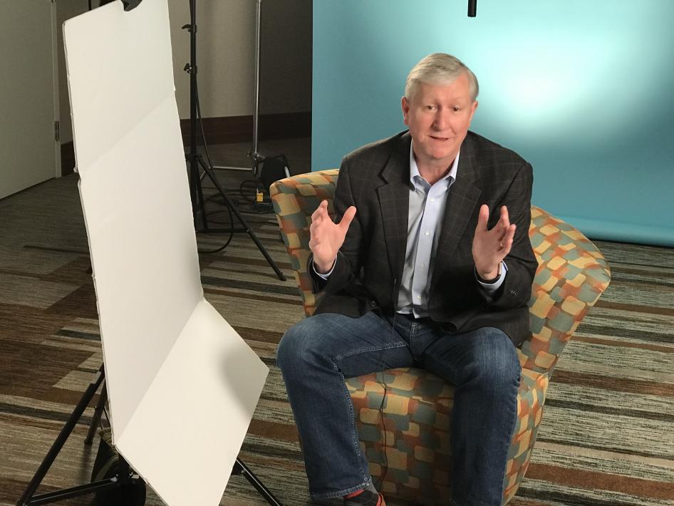 Ken Taylor sitting in a seat being interviewed