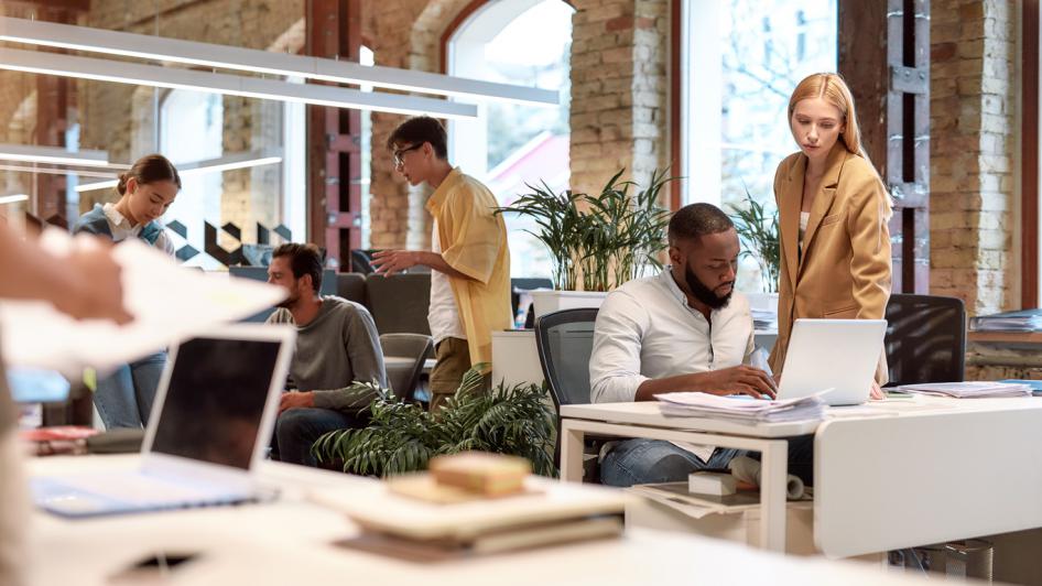 Photo Employees Working Together in an office