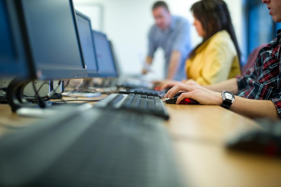 Row of students working on computers